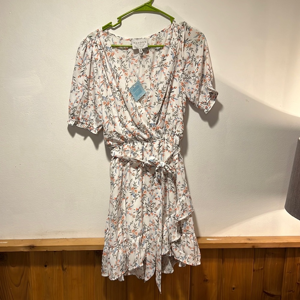 Brand new never wore white floral mid sleeve dress. Smoke free pet free home